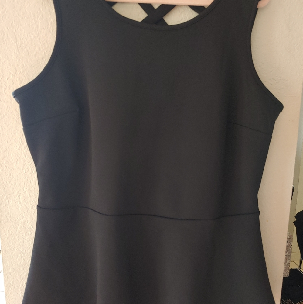 Black sleeveless peplum blouse